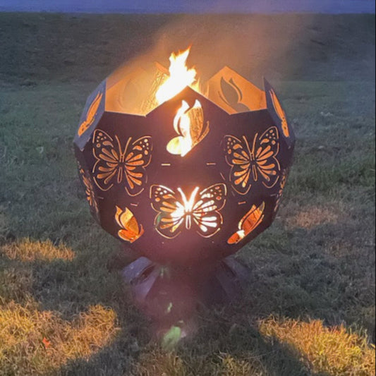 Butterfly themed fire pit with fire burning