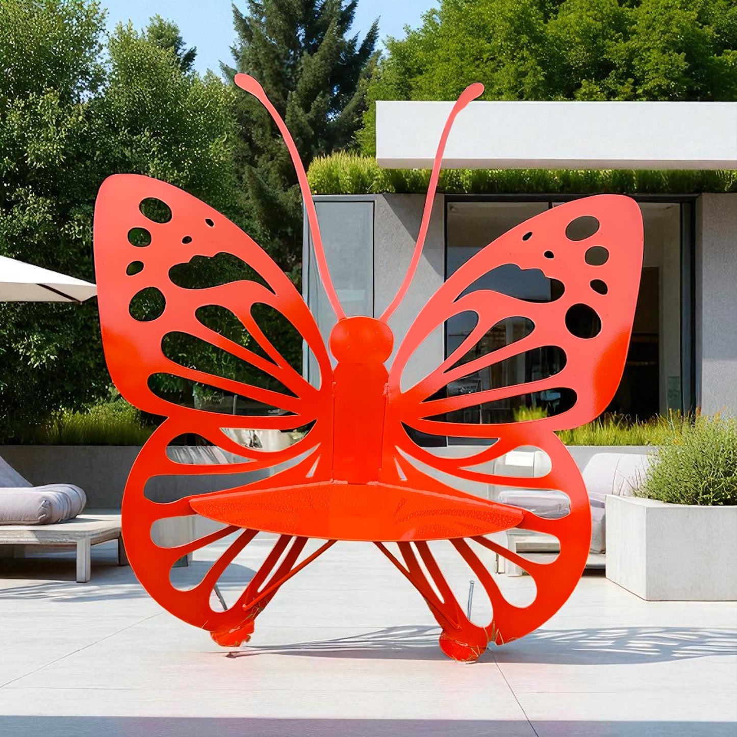 Orange butterfly-shaped outdoor bench in a modern garden setting