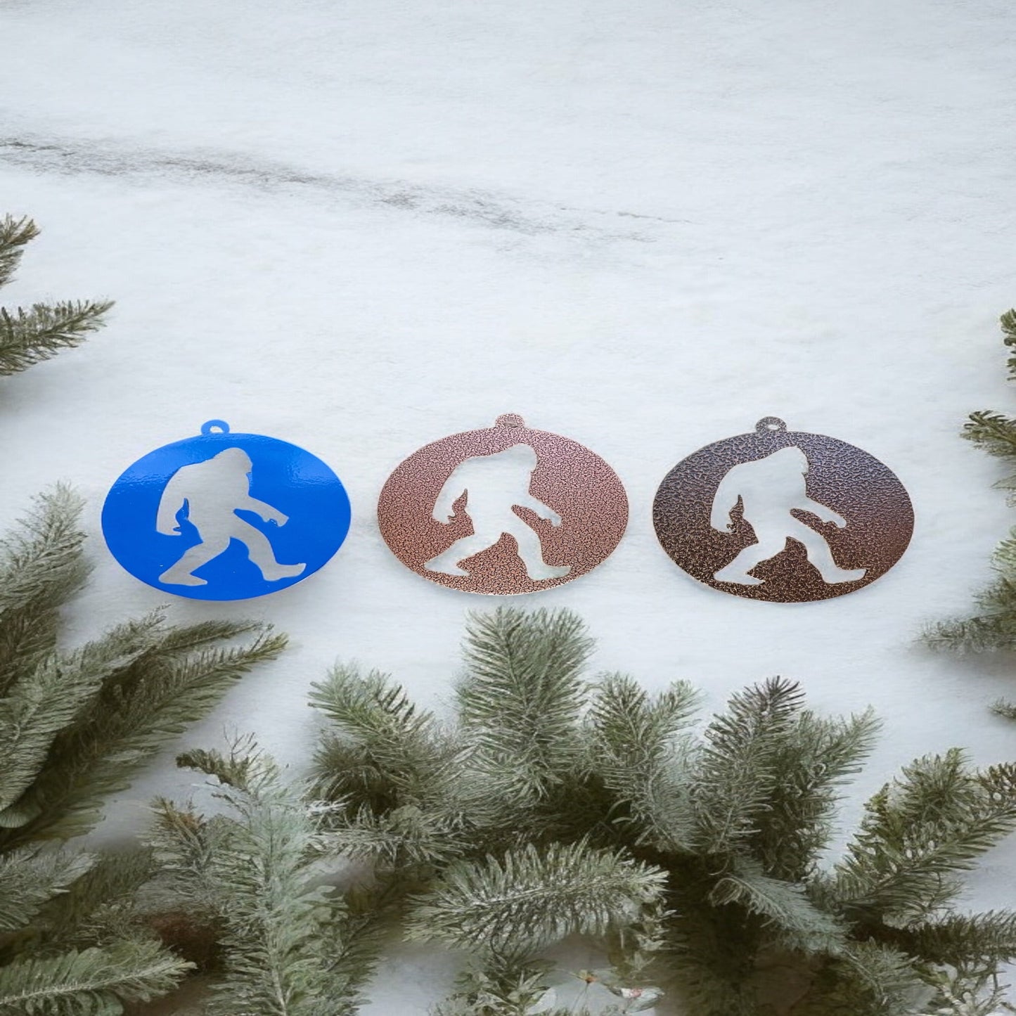 Round metal Christmas ornaments with Bigfoot silhouette