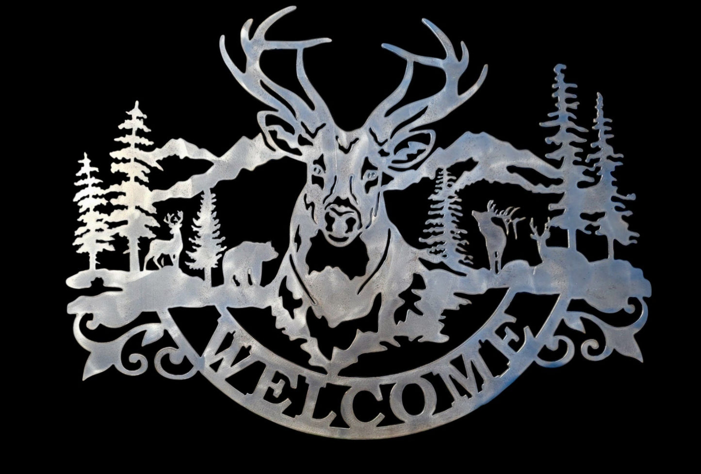 Decorative metal sign with a deer, buck, bear, and elk with 'Welcome' text against a black background