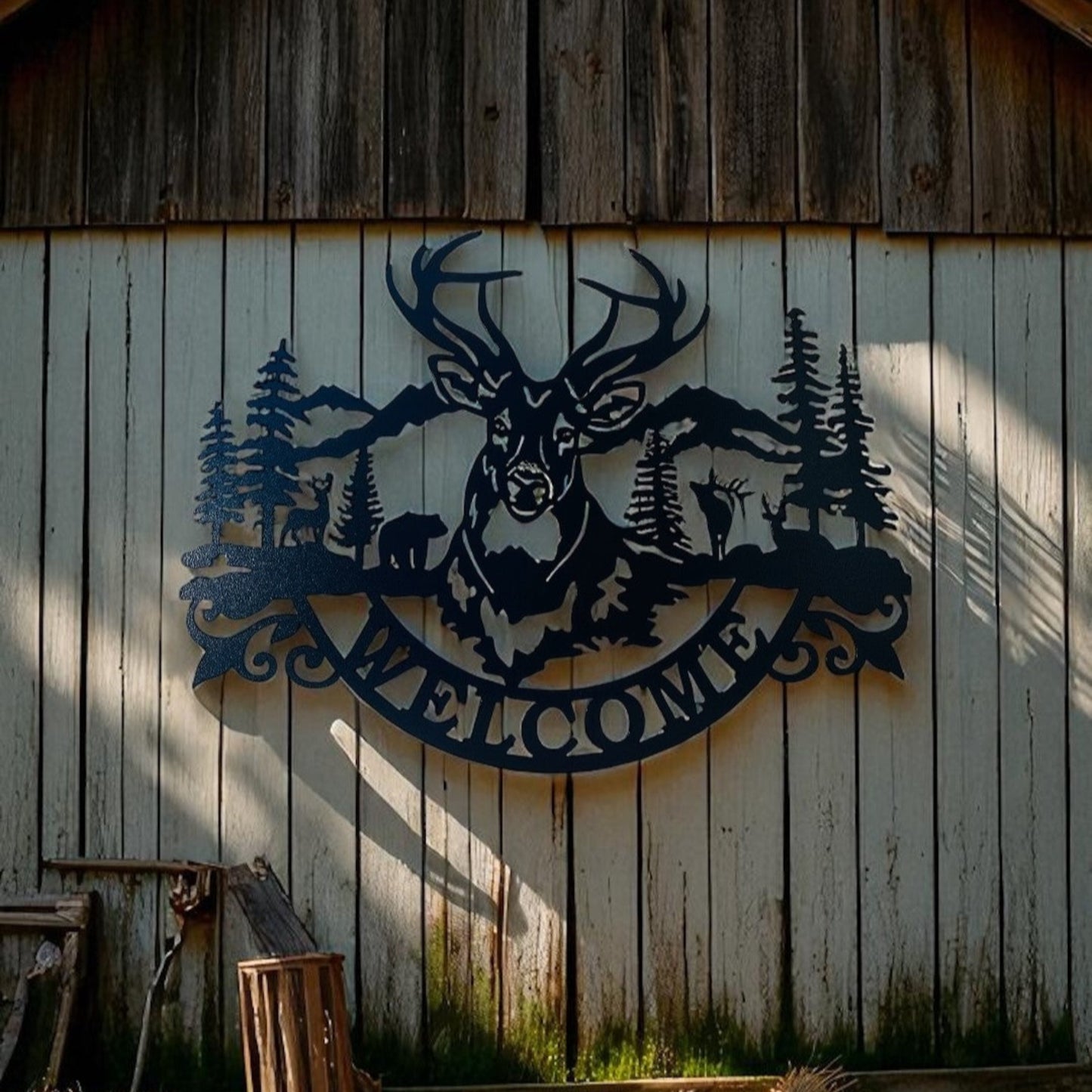 Decorative metal welcome sign with a deer, bear, buck, and elk and forest design on a wooden wall.