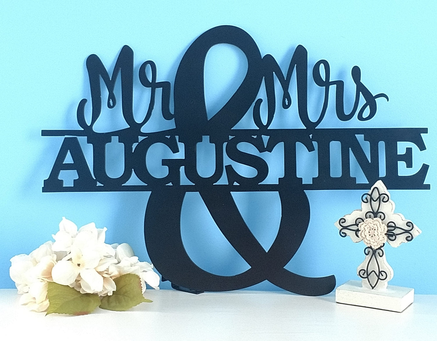 Metal wall decor which says Mr. & Mrs. personalized with last name