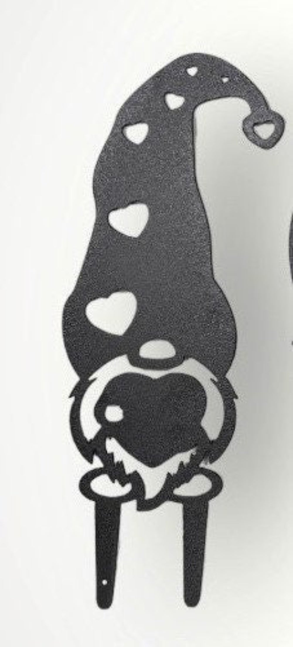 Small metal garden gnome with hearts