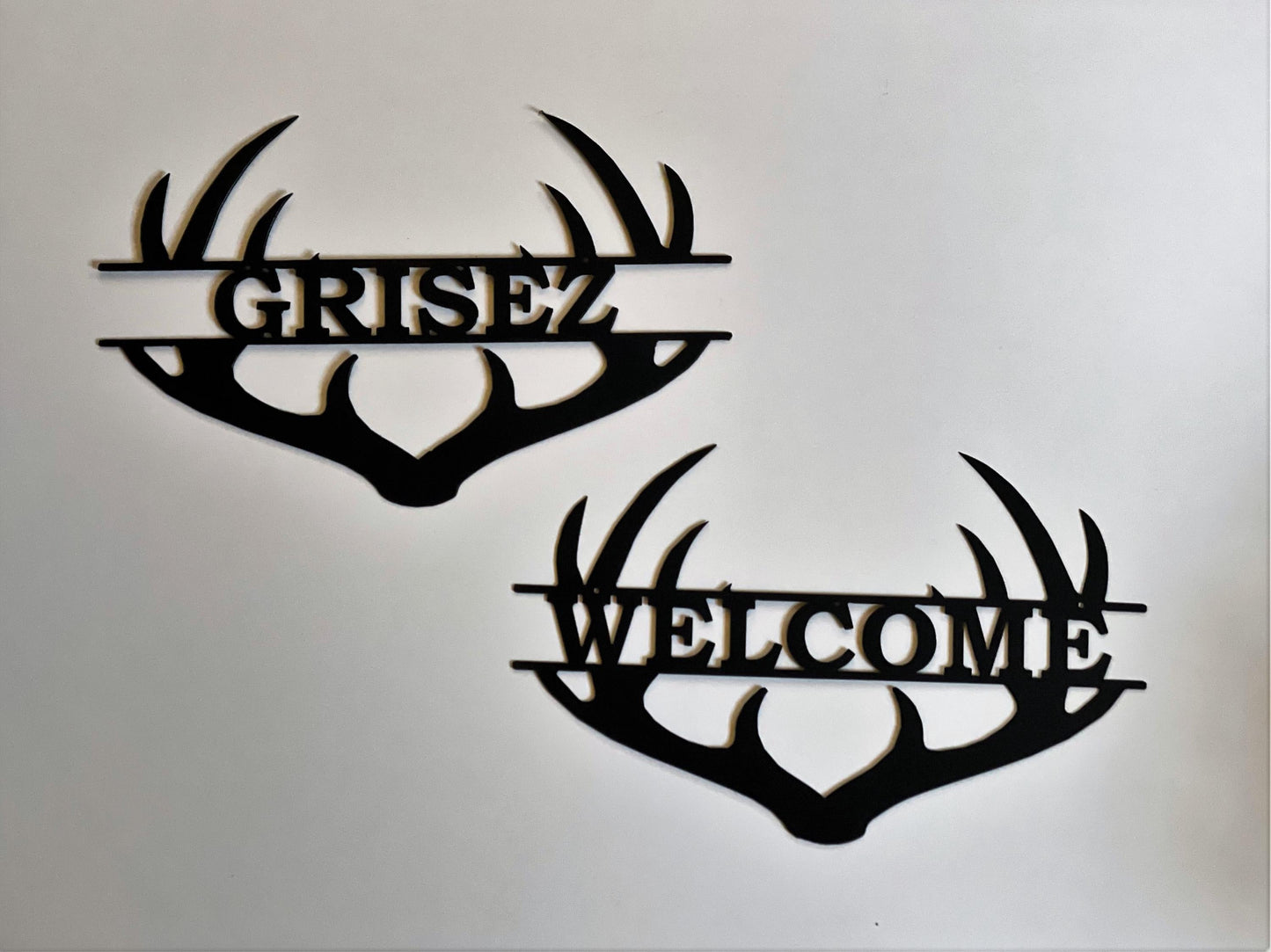 Both welcome and custom name antler sign
