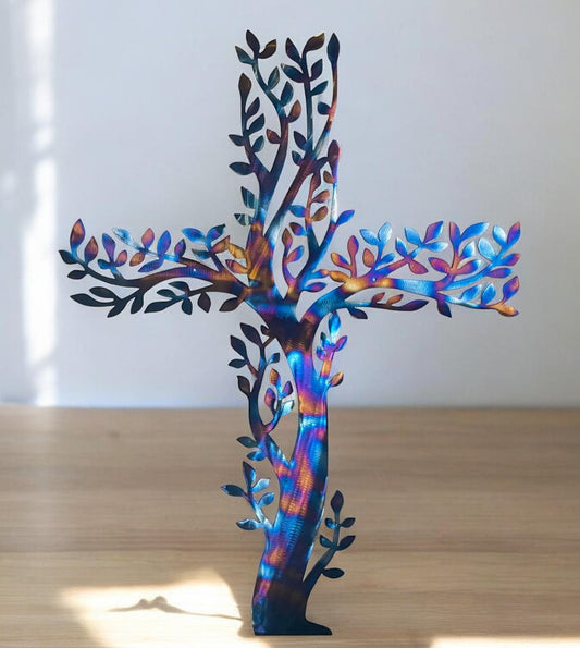 Multicolored metal wall art cross created with branches and leaves