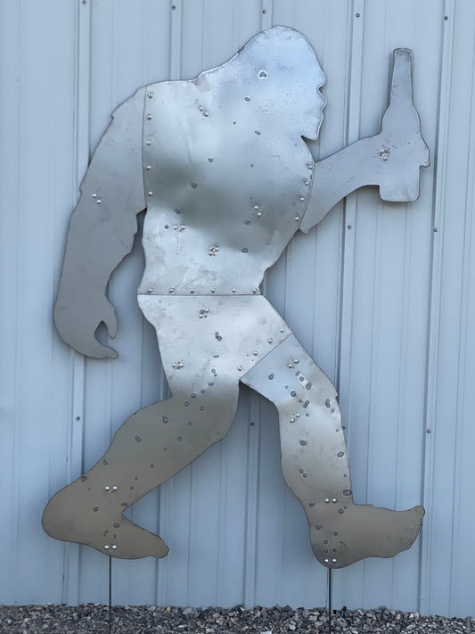 Large metal Sasquatch holding a beverage.