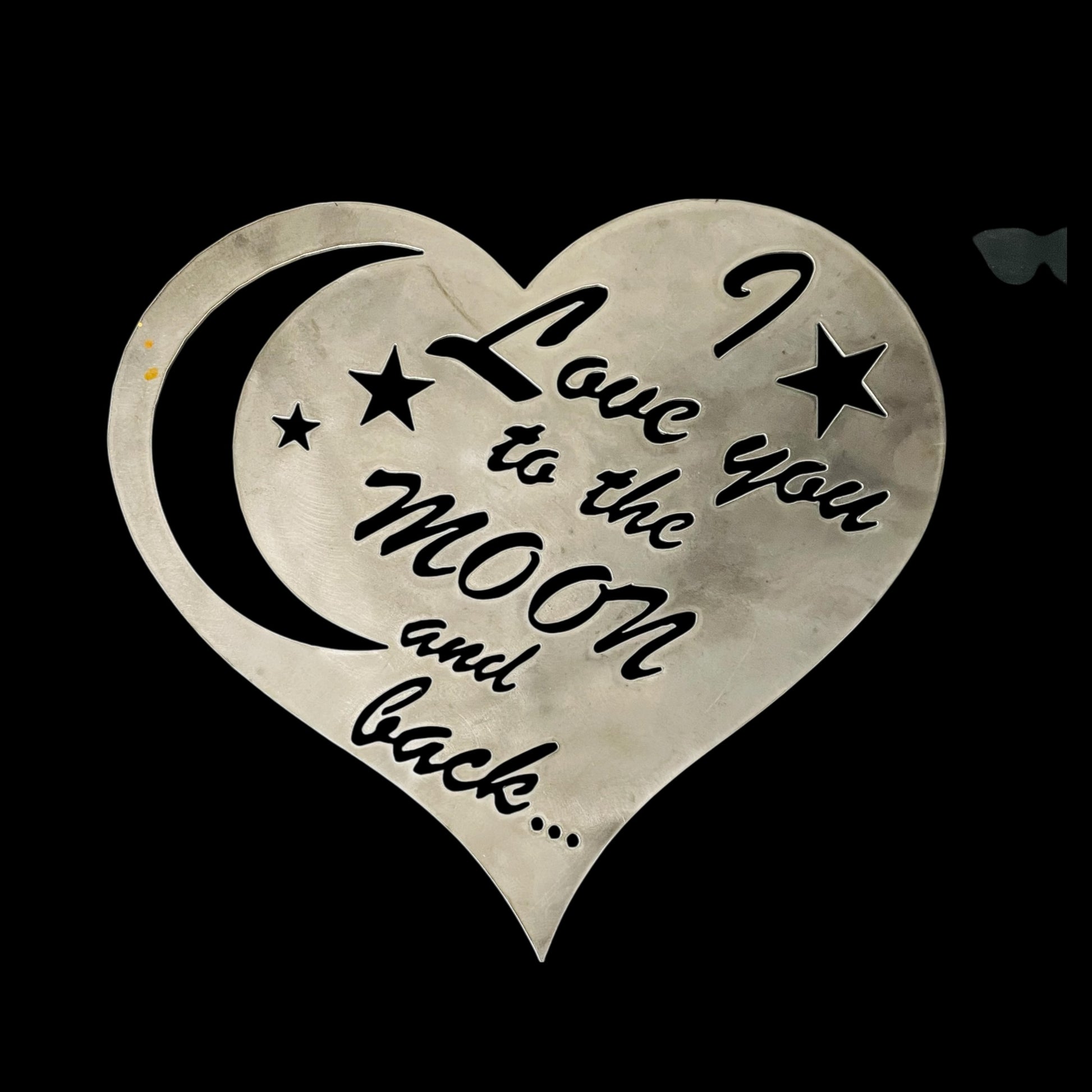 Heart-shaped design with 'I love you to the moon and back' text on a black background