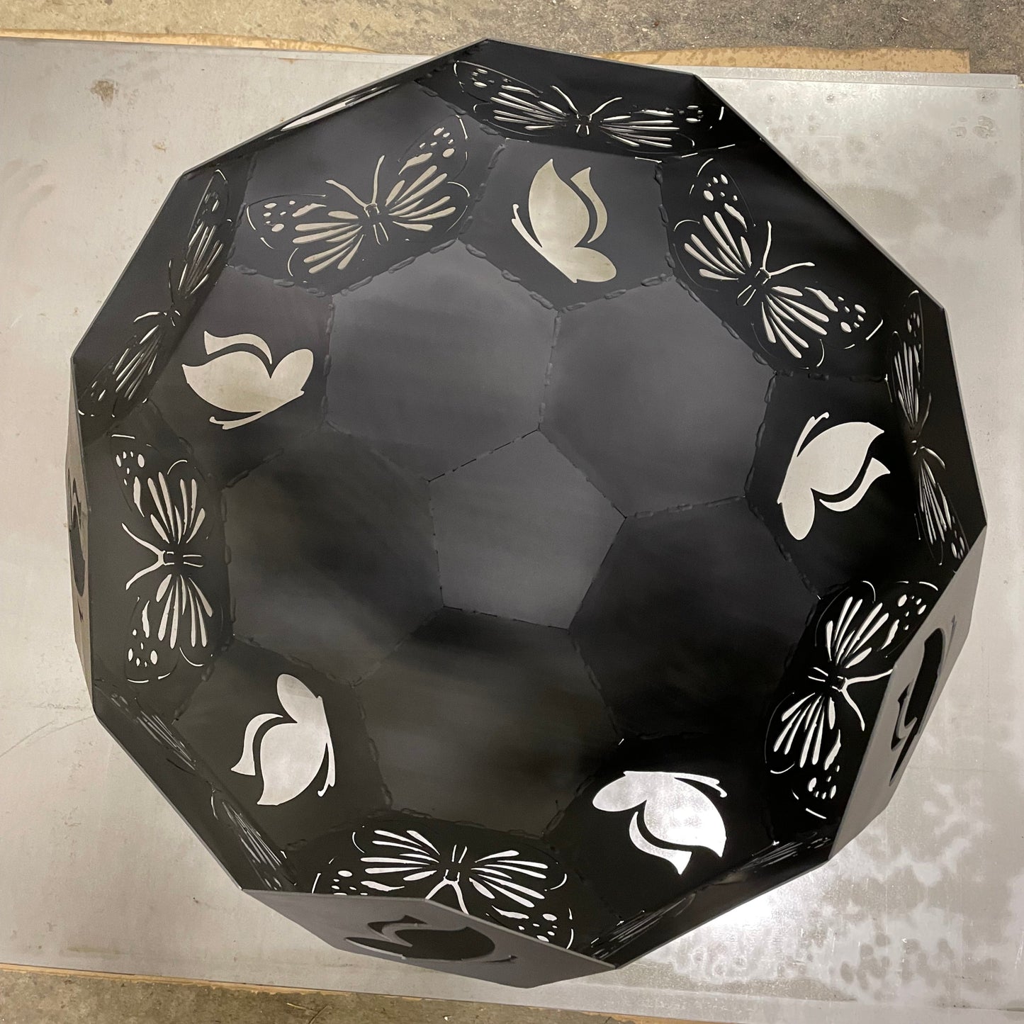Top view of butterfly themed fire pit