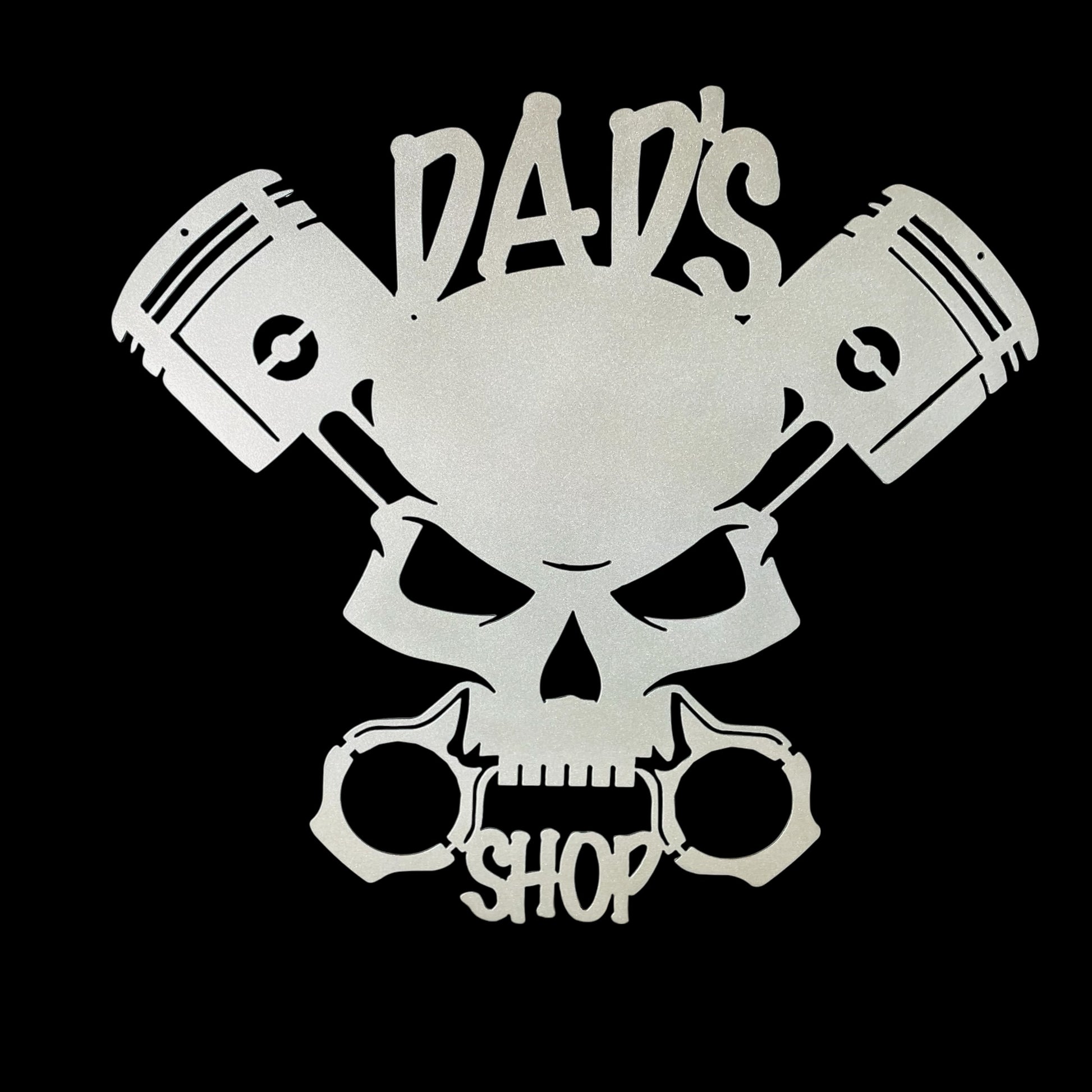 Skull with crossed pistons and 'Dad's Shop' text on a black background