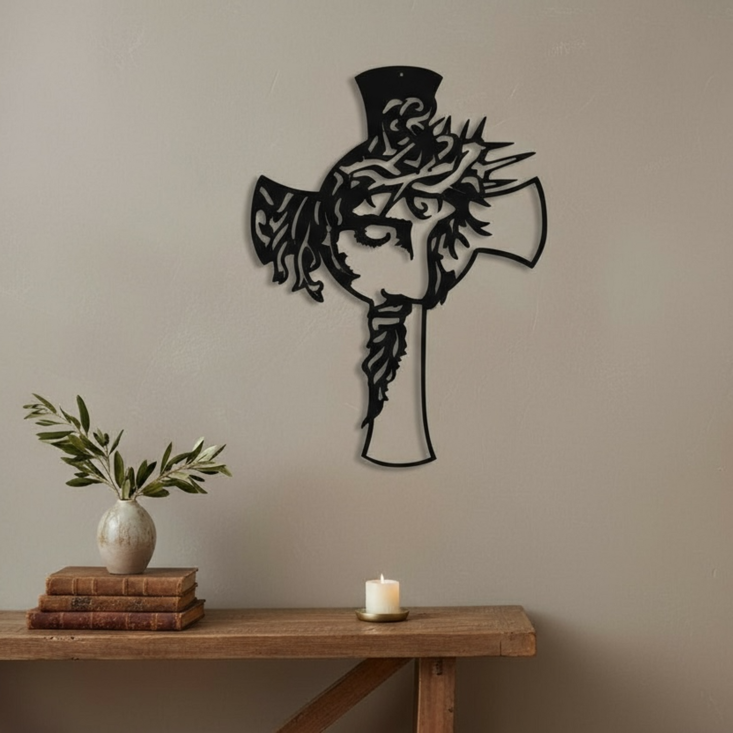 Decorative wall art of a cross with the face of Jesus' on a beige wall in a living room.