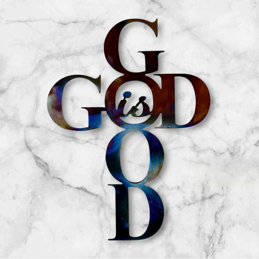Colorful 'GOD is Good" metal wall art on a marble background