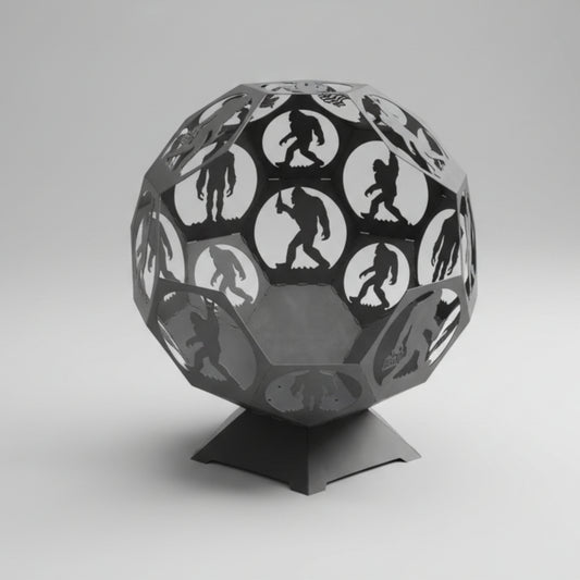 Bigfoot themed metal fire pit with cut-out designs on a concrete floor