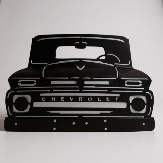 Black silhouette of a Chevrolet truck on a white background