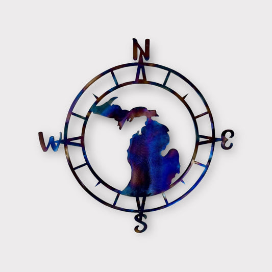Metal compass wall decor with the state of Michigan silhouette in the middle.  All states available.  Multicolored