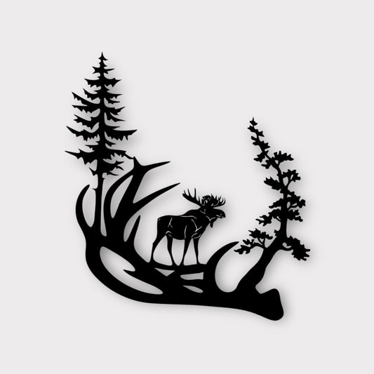 Moose standing on a large antler with trees extending out.