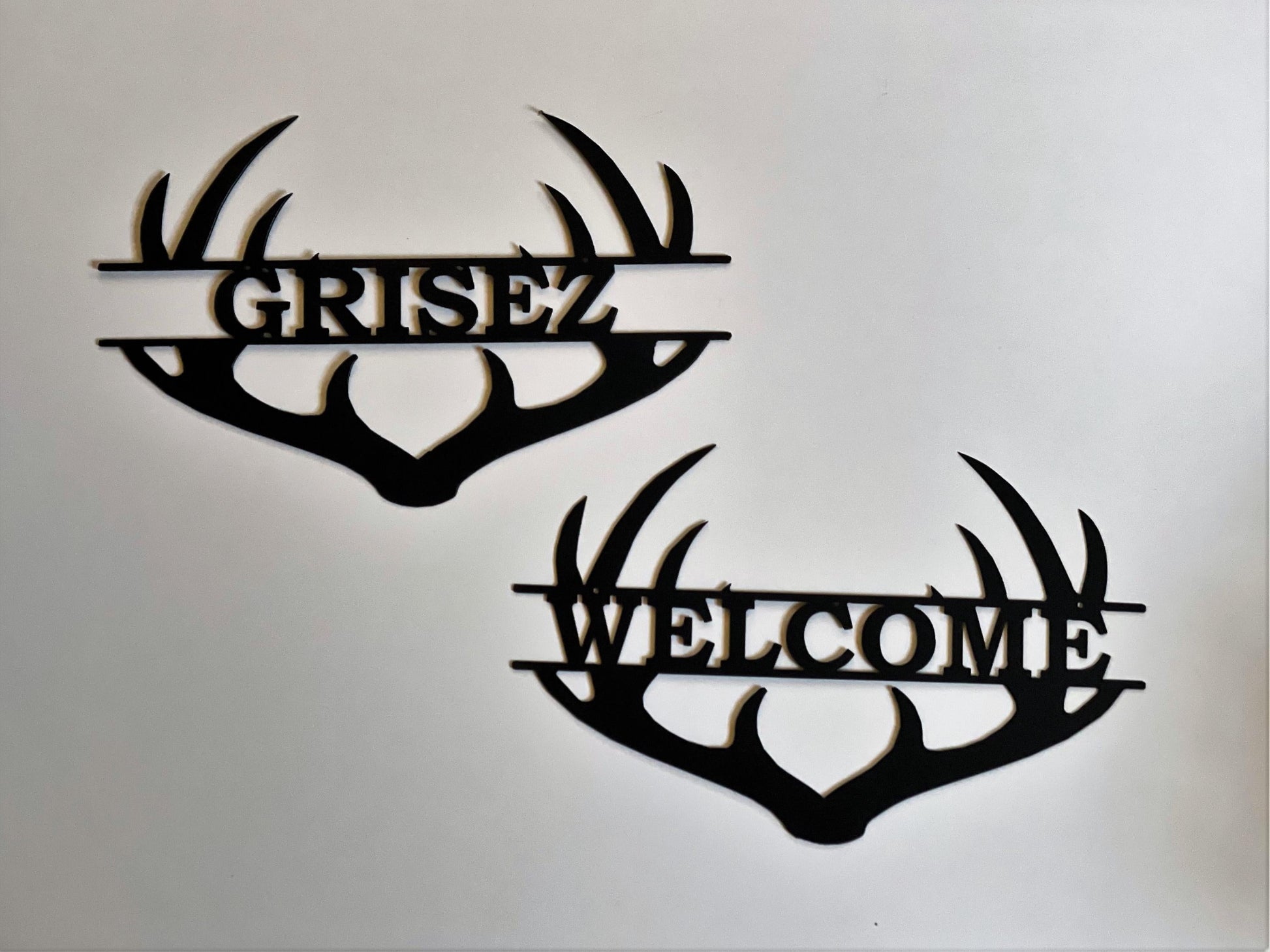 Both welcome and custom name antler sign