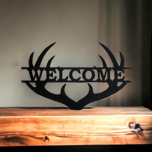 Antler metal wall sign with the word "welcome"