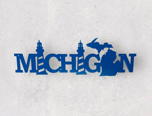 Metal wall art that says Michigan.  Both "I" are replaced with lighthouse graphics. The "A" is a Michigan silhouette