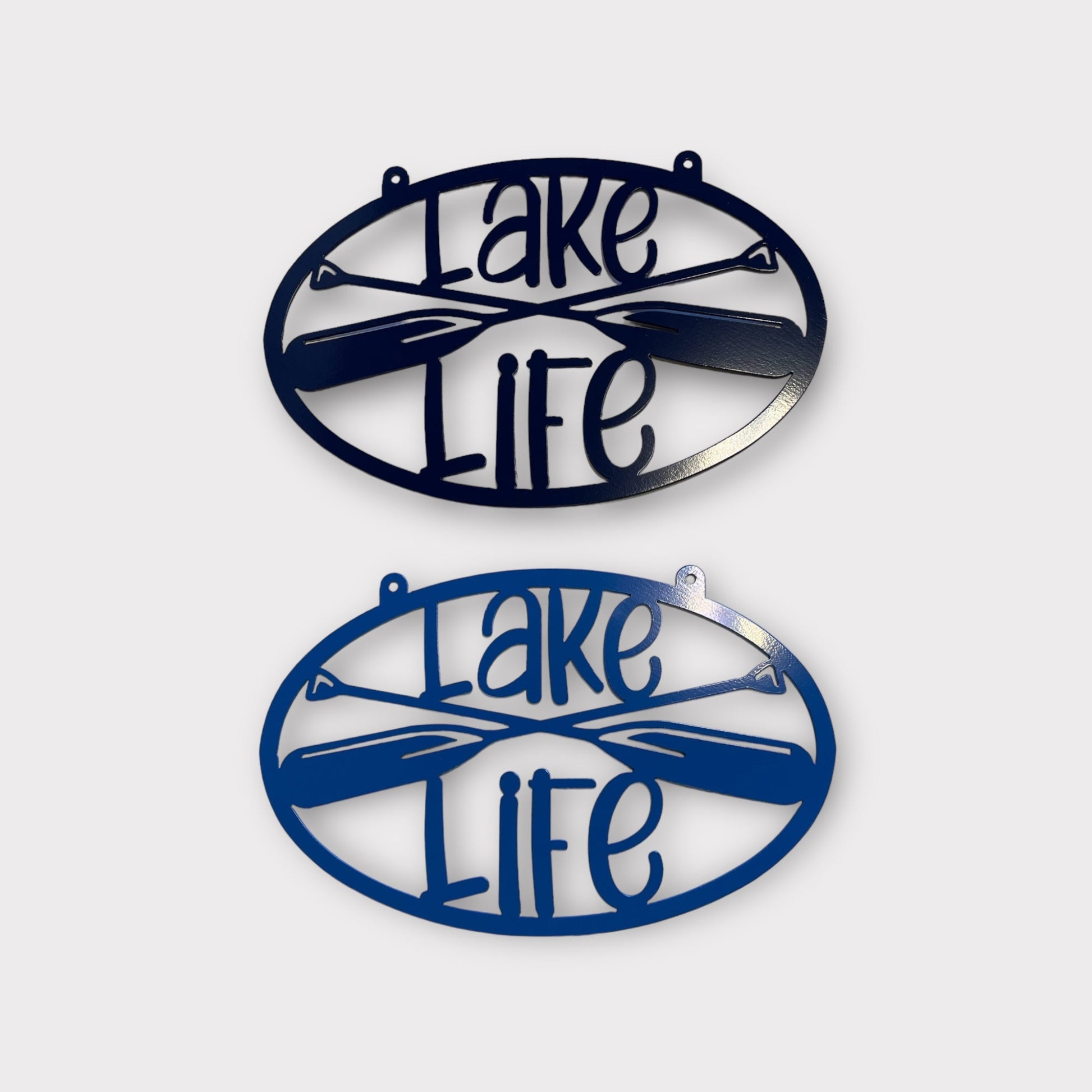 Two metal wall art pieces with 'Lake Life' text and paddle design on a white background.